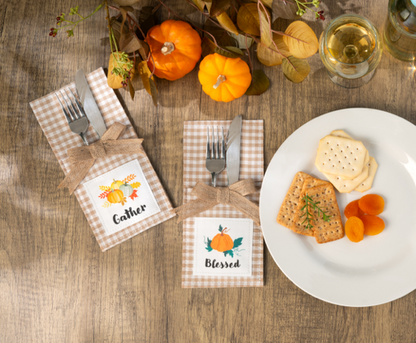 Country Thanksgiving Utensil Pockets, Set of Four, Four tan gingham utensil pockets with jute bows and printed patches reading Thankful, Grateful, Blessed and Gather, one holding a fork and knife.
