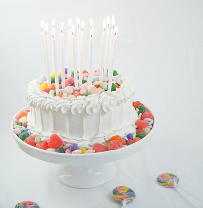 Juego de 16 velas altas con purpurina blanca