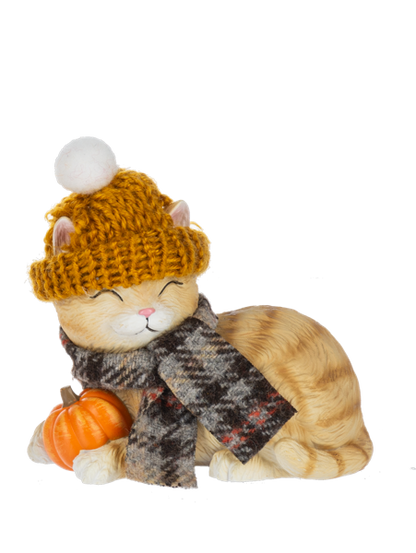 Dressed Up Fall Cat Figurine, Three tabby cat figurines in pom-pom knit hats and scarves, one sleeping beside a pumpkin, one holding a pumpkin coffee cup and one holding a sunflower.