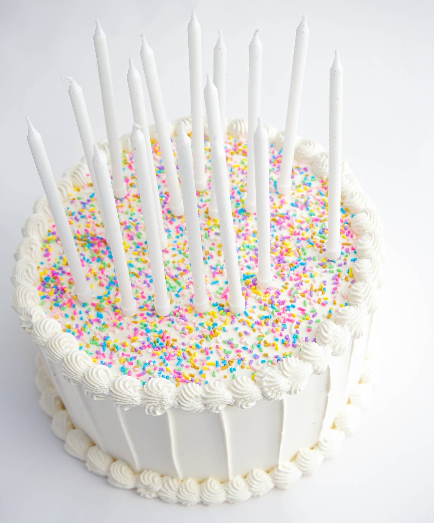 Juego de 16 velas altas con purpurina blanca