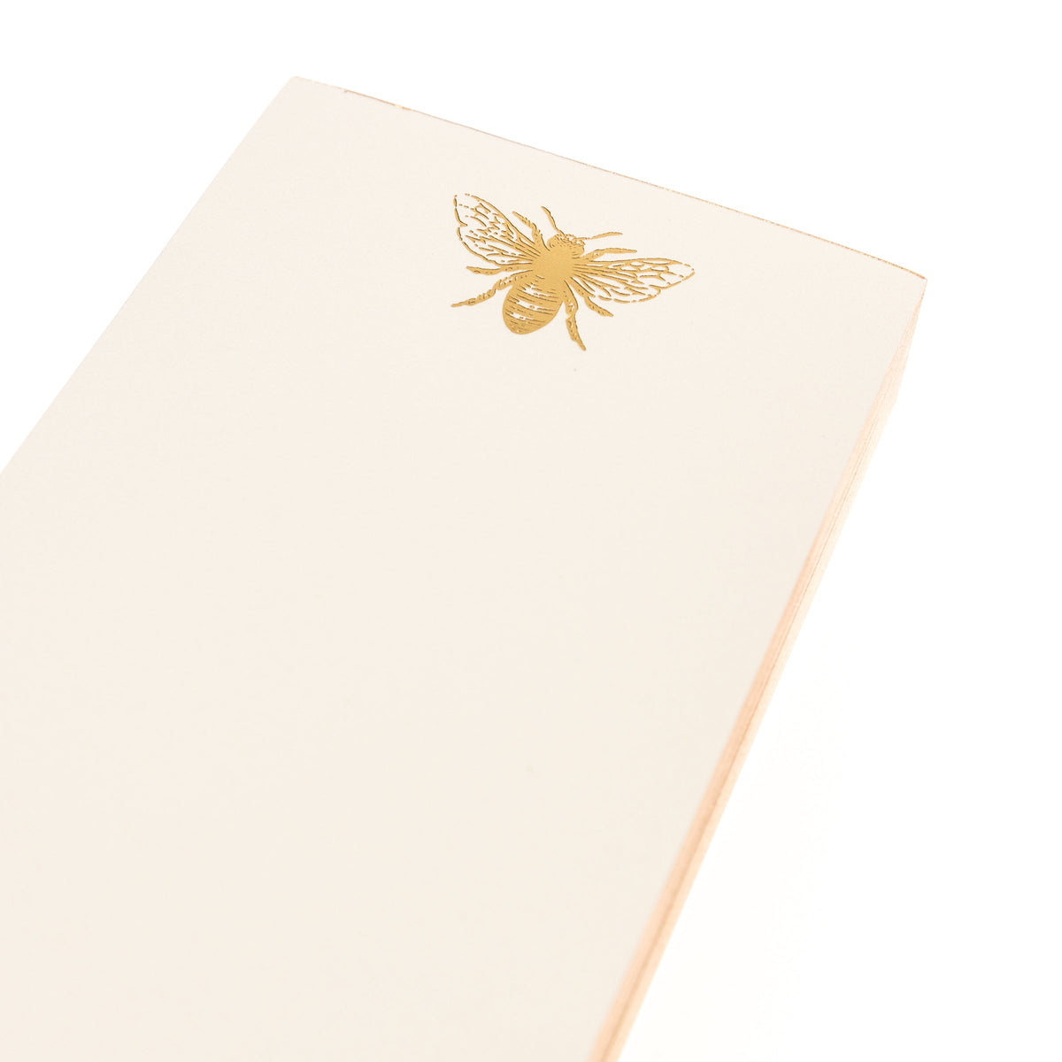 La Petite Presse Bee Gilded Desktop Notepad, A cream notepad with a gold foil bee at the top and the words Busy Bee stamped in gold at the bottom, with a gold gilded edge.