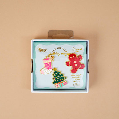 Enamel Pin Pack, A boxed set of three gold enamel pins in the Latte Love design, a coffee cup, a teddy bear, and a pink bow.