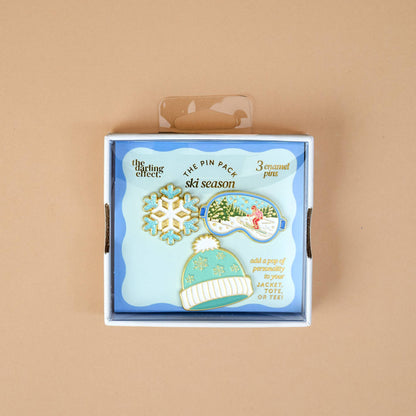 Enamel Pin Pack, A boxed set of three gold enamel pins in the Latte Love design, a coffee cup, a teddy bear, and a pink bow.