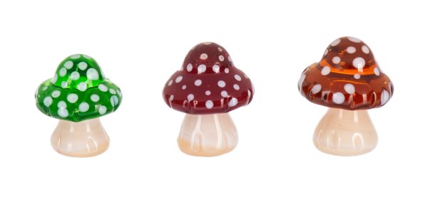 Enchanted Mushroom Pocket Charm, Three glossy polka-dot mushroom figurines with green, burgundy and amber caps on cream stems.
