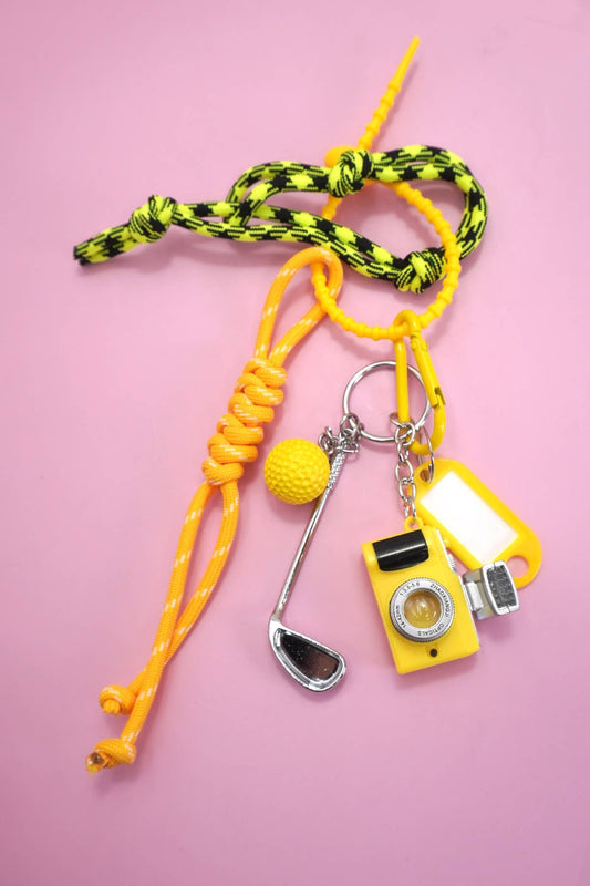 LLAVERO CON DIJE PARA BOLSA DE GOLF CON CABLE DE CUERDA Y CÁMARA