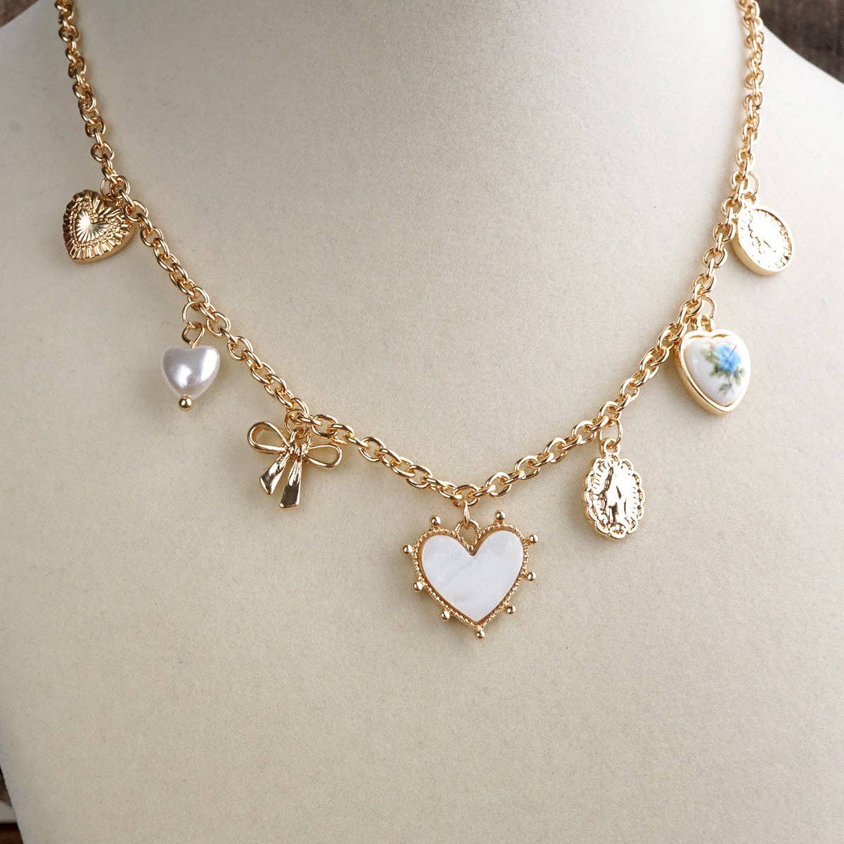 Multi-Charm Heart Necklace in Gold Tone