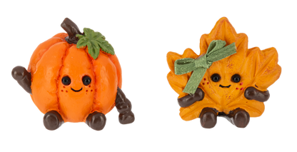 Fall Friend Pocket Charm, A smiling orange pumpkin figurine and a smiling maple leaf figurine with a green ribbon bow.