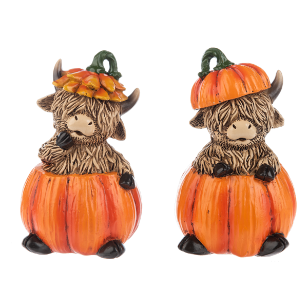 Fall Highland Cow Figurine, Two shaggy brown Highland cow figurines sitting in orange pumpkins, one in an orange petal hat and one wearing a pumpkin lid.