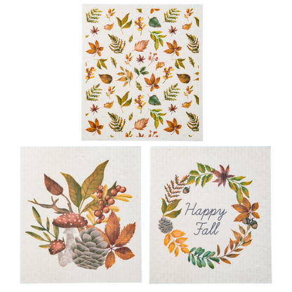 Fall Reusable Dish Cloth, Three square dish cloths printed with a Happy Fall leaf wreath, a mushroom and pinecone bouquet and a scatter of autumn leaves.