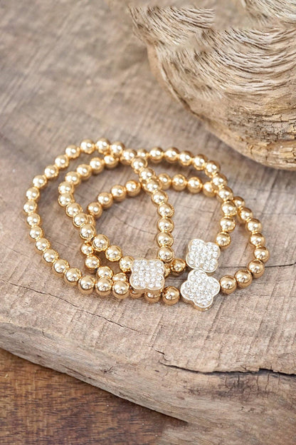 Pulsera de cuentas de bolas en tono dorado con diseño de trébol de cristal (pila de 3 pulseras)