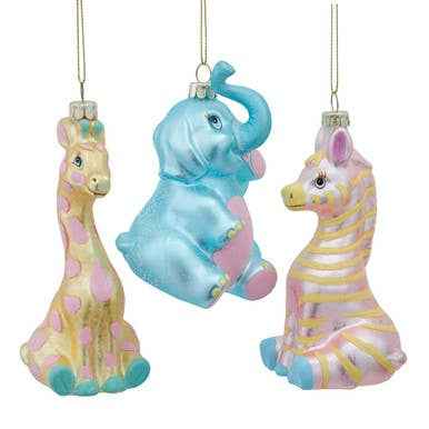A glass baby animal ornament, sitting, painted in nursery pastels.
