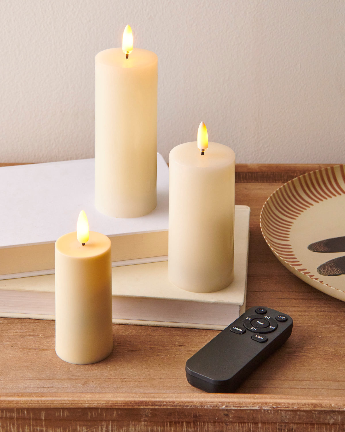 Flameless Candle Remote Control with Timer, A black handheld remote with nine labeled keys: On and Off at the top, a round Timer key ringed by 2H, 4H, 6H and 8H, and Candle and Light keys below.