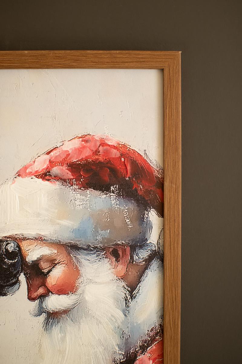 Framed Santa with Deer Painting, A framed painting of Santa standing beside a deer in a winter scene.