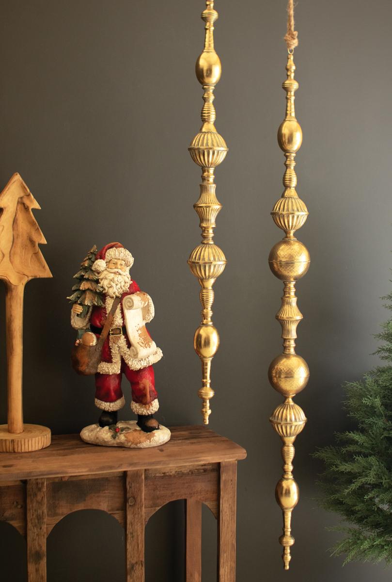 Giant Metal Christmas Finial, Two tall hanging metal finials in a distressed gold finish, one longer than the other.