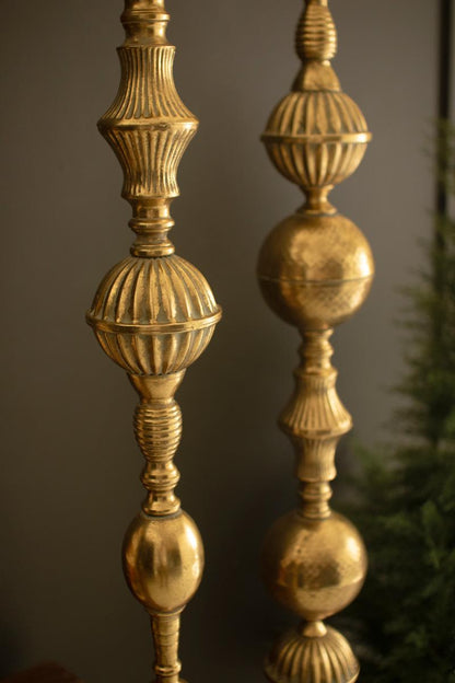Giant Metal Christmas Finial, Two tall hanging metal finials in a distressed gold finish, one longer than the other.