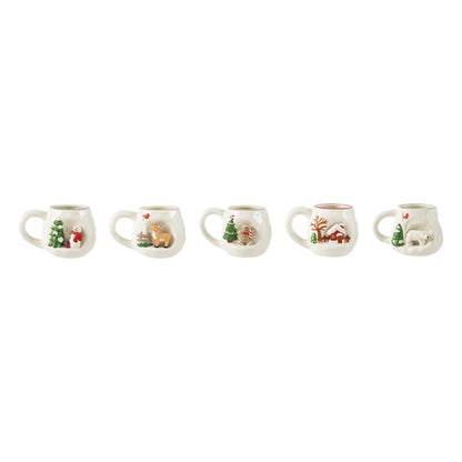 Hand-Painted Stoneware Christmas Mug, Five cream stoneware mugs in a row, each with a raised scene: a tree and snowman, a fawn and fence, a tree and gingerbread man, a red cottage and a polar bear.