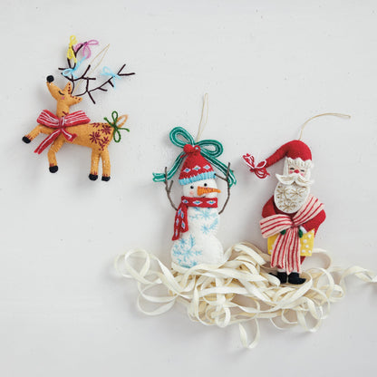 Handmade Embroidered Wool Felt Holiday Ornament, shown in a styled holiday setting