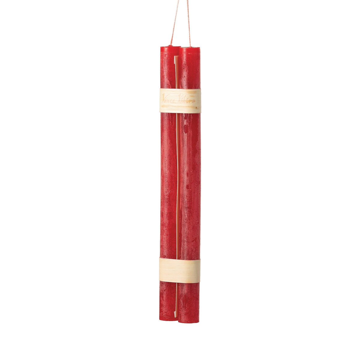 Hanging Timber Taper Candles 12 Inch, Pair, Two amber colored taper candles bound together with cream paper bands hang side by side against a plain white background.