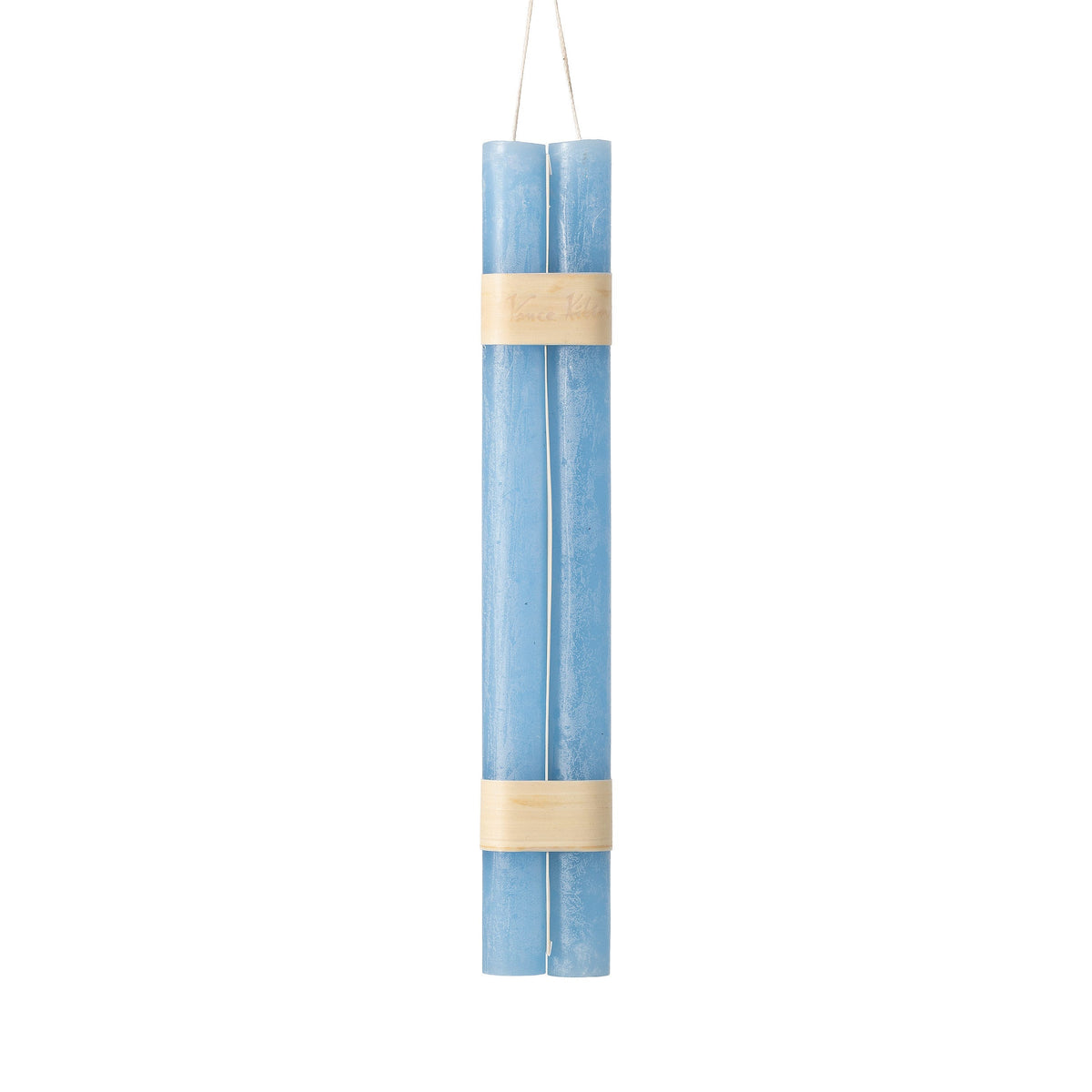 Hanging Timber Taper Candles 12 Inch, Pair, Two amber colored taper candles bound together with cream paper bands hang side by side against a plain white background.