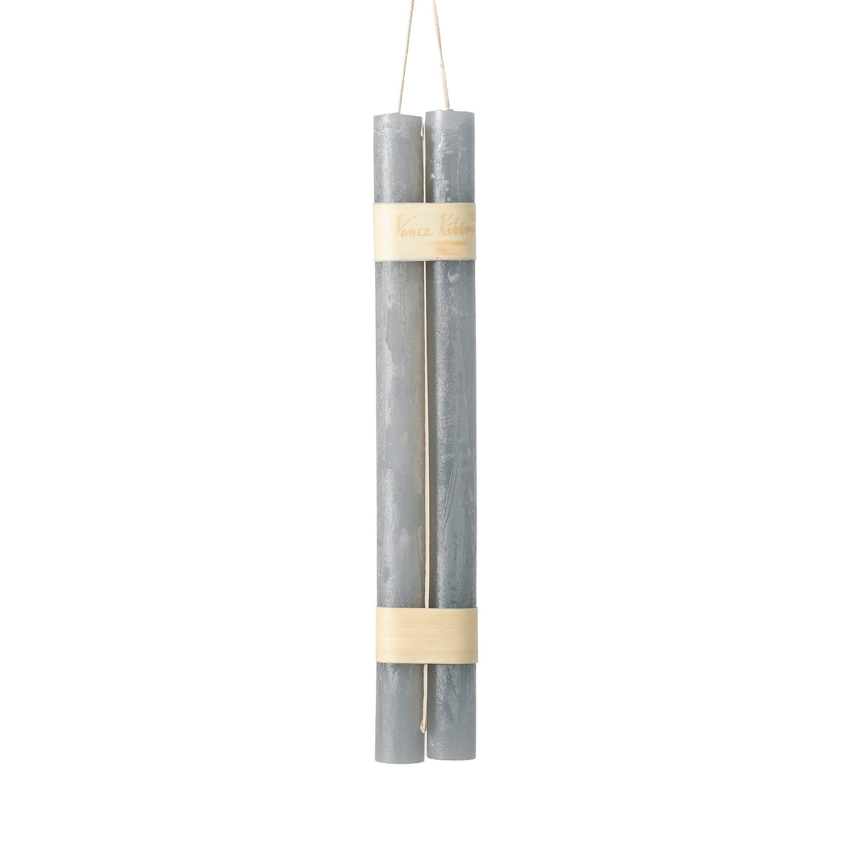 Hanging Timber Taper Candles 12 Inch, Pair, Two amber colored taper candles bound together with cream paper bands hang side by side against a plain white background.
