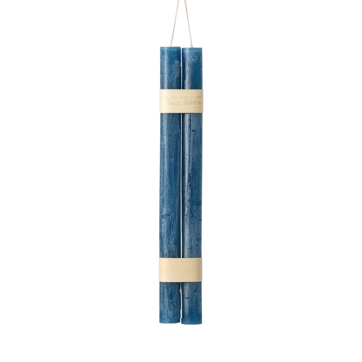 Hanging Timber Taper Candles 12 Inch, Pair, Two amber colored taper candles bound together with cream paper bands hang side by side against a plain white background.