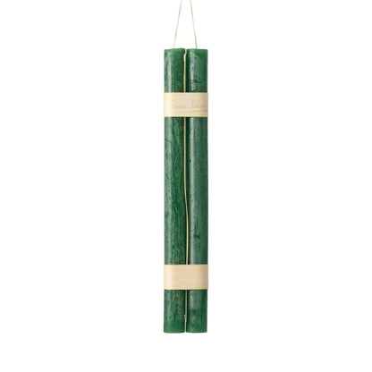 Hanging Timber Taper Candles 12 Inch, Pair, Two amber colored taper candles bound together with cream paper bands hang side by side against a plain white background.