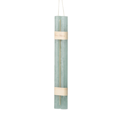 Hanging Timber Taper Candles 12 Inch, Pair, Two amber colored taper candles bound together with cream paper bands hang side by side against a plain white background.