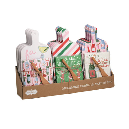 Holiday Bar Melamine Board with Napkins and Spreader, Three holiday melamine paddle boards, each with a wrapped pack of cocktail napkins and a wooden spreader tied on.