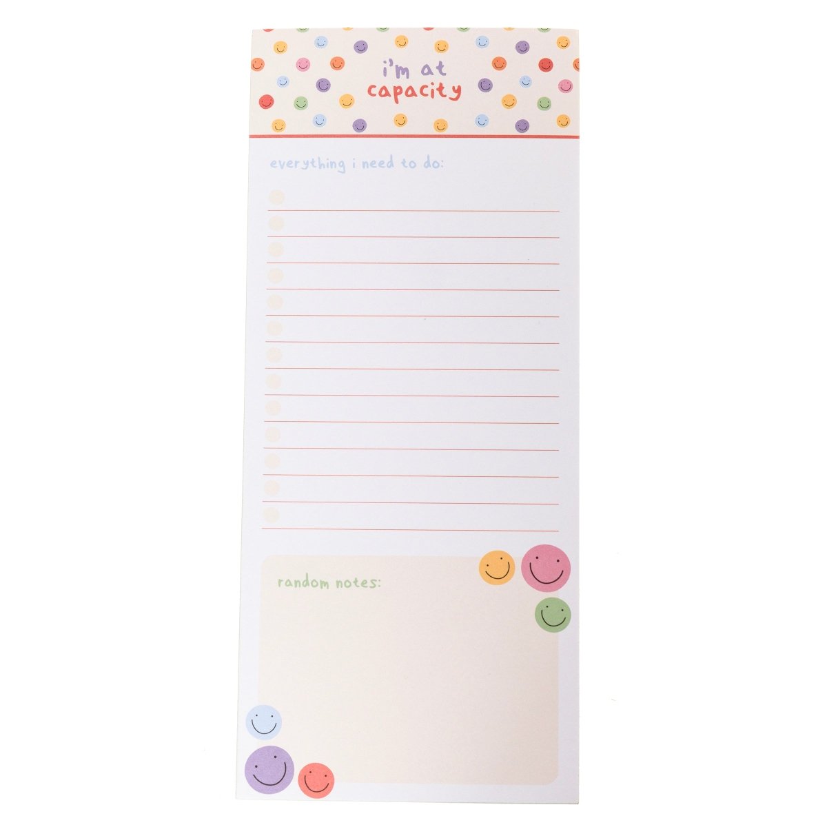 I'm At Capacity Magnetic Notepad, A tall magnetic notepad printed 'i'm at capacity' with colorful smiley polka dots above a lined checklist and a 'random notes' section.