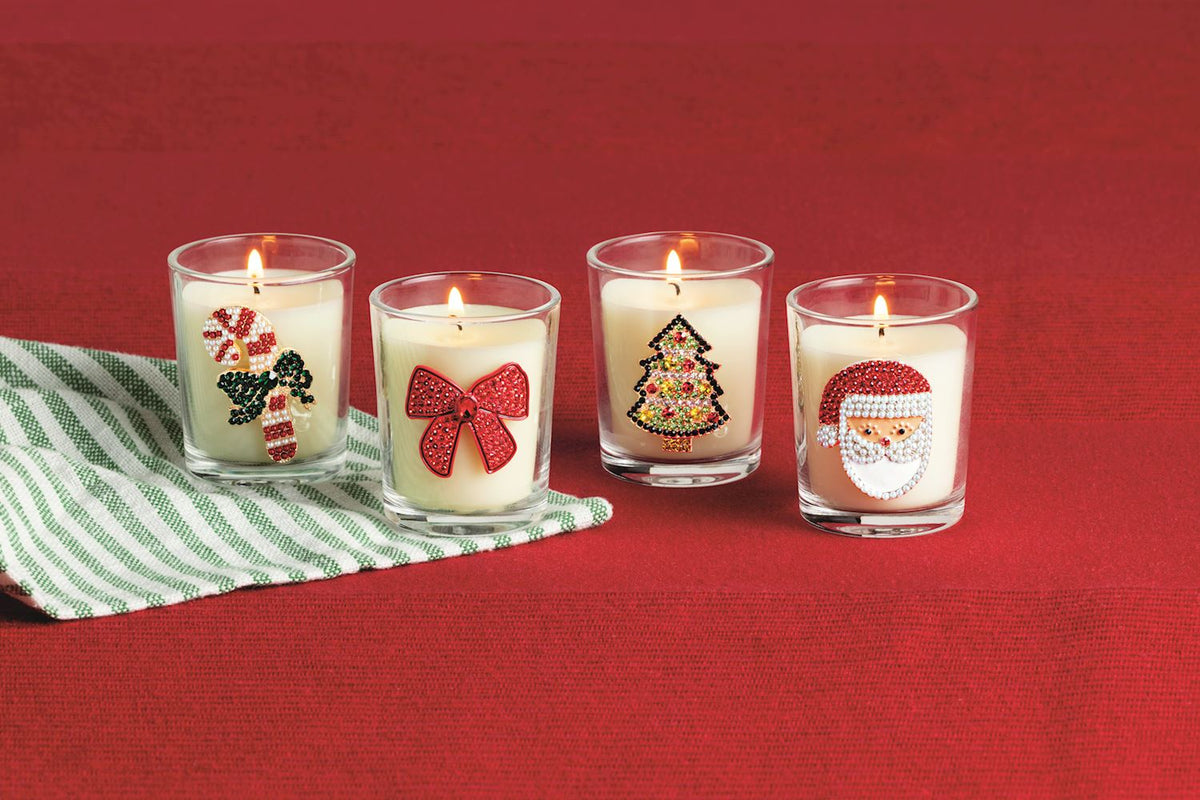 Jeweled Christmas Icon Votive Candle, Four glass votive candles with beaded icons: a candy cane, a red bow, a Christmas tree and Santa.