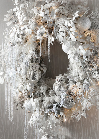 Jeweled Snowy Owl Ornament, A pearlescent white glass owl ornament with glittered eyes and clusters of pearl beading on its wings.