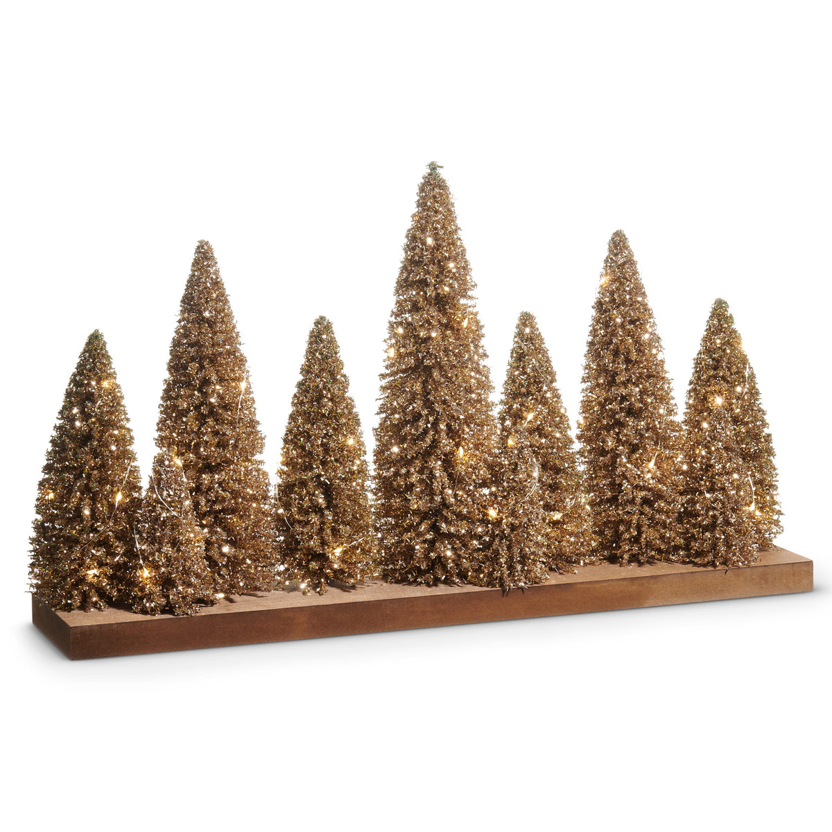 Lighted Champagne Glitter Bottle Brush Trees on Wood Base, A row of champagne gold glitter bottle brush trees in staggered heights on a long wood base, strung with tiny warm white lights.