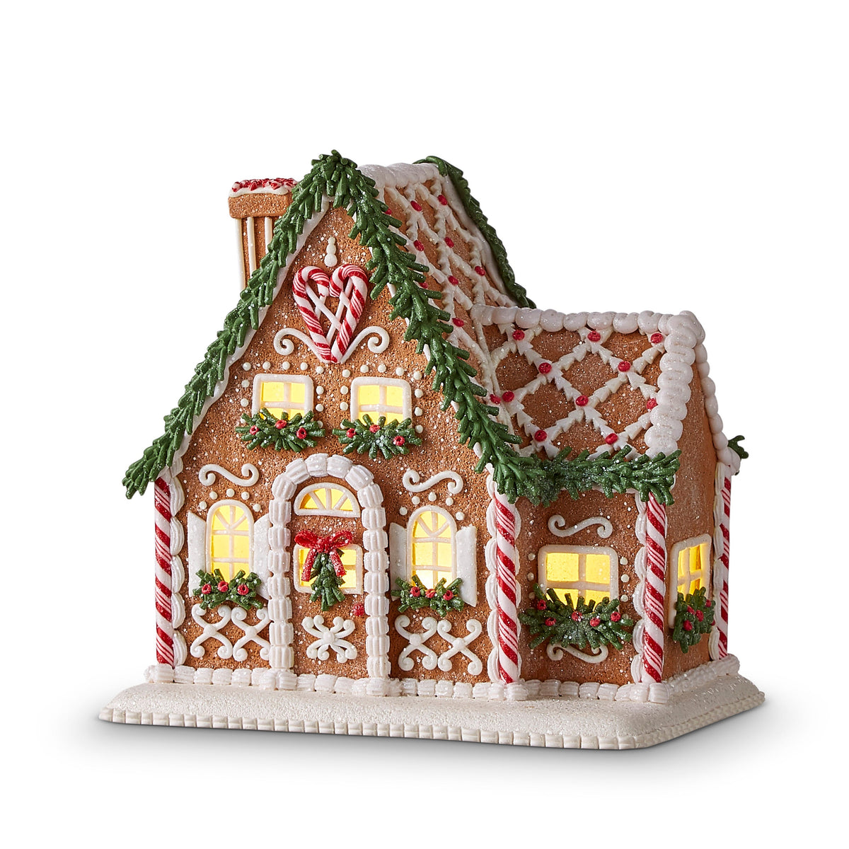 Lighted Gingerbread House with Chimney, A lit gingerbread house figurine with a candy cane chimney, garland trim, and icing details on a snow-covered base.