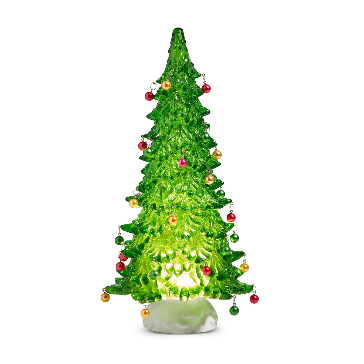 Lighted Green Tree with Ornaments and Swirling Glitter, A lighted green tree on a white base hung with small red, gold and green ball ornaments.