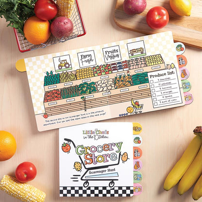 Little Chefs in the Kitchen Grocery Store Scavenger Hunt Board Book, The cover of the Grocery Store Scavenger Hunt board book, showing a shopping cart with three smiling food characters above a black and white checkered band, with six food-picture tabs down the right edge.