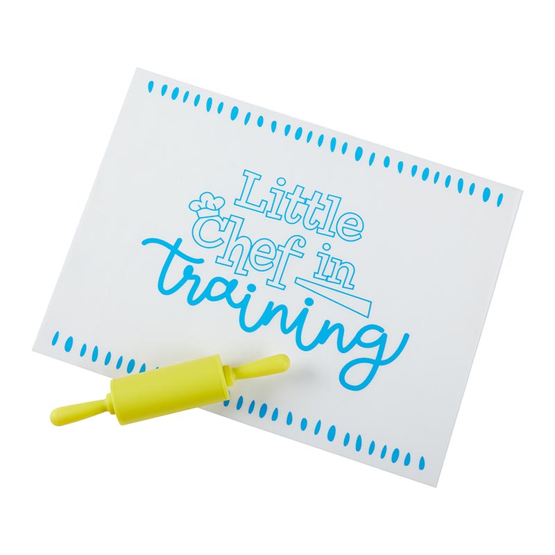 Little Chefs in the Kitchen Rolling Pin with Baking Mat, A clear gift box holding a yellow rolling pin and a folded baking mat, with a Little Chefs in the Kitchen label on a sprinkle-dot backing card.