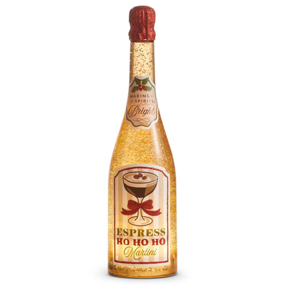 Making Spirits Bright Lighted Espresso Martini Glitter Bottle, An amber bottle lit from within and filled with gold glitter, capped in red glitter, with a Making Spirits Bright neck label under holly and a main label showing an espresso martini glass tied with a red bow above the words Espress Ho Ho Ho Martini.