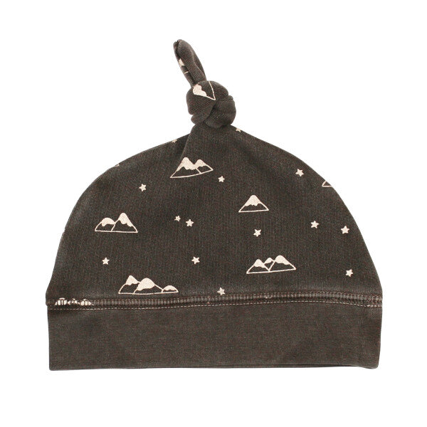 Organic Cozy Top-Knot Hat, Bark Mountains Print, A dark brown knit baby hat with a top knot tie and a cream mountains and stars print.