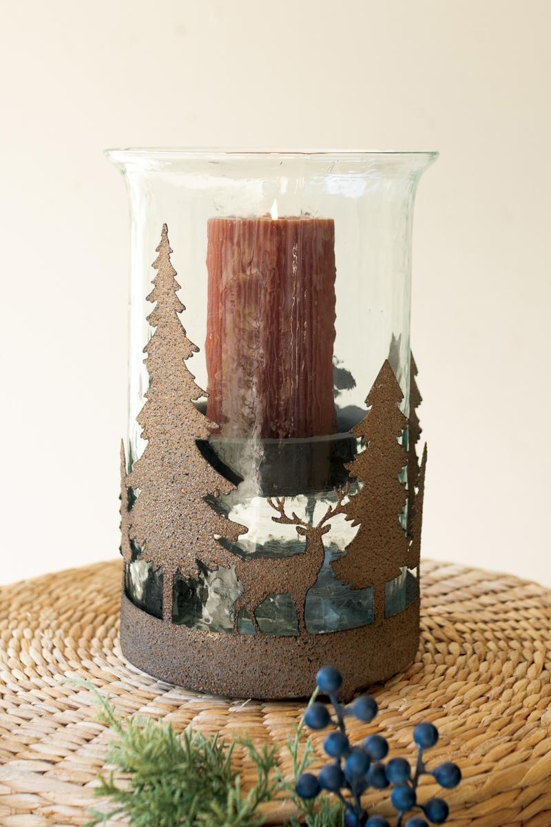 Metal Christmas Trees and Deer Cylinder Wrap, A cylindrical iron sleeve with cutout Christmas trees and deer, standing on three ball feet.