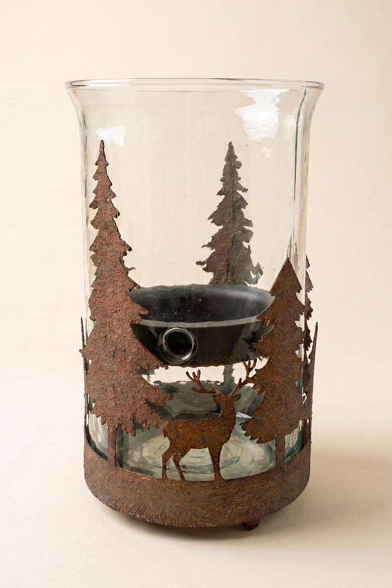 Metal Christmas Trees and Deer Cylinder Wrap, A cylindrical iron sleeve with cutout Christmas trees and deer, standing on three ball feet.