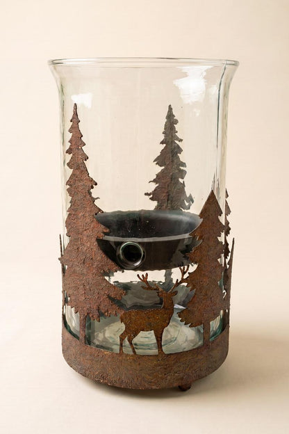 Metal Christmas Trees and Deer Cylinder Wrap, A cylindrical iron sleeve with cutout Christmas trees and deer, standing on three ball feet.
