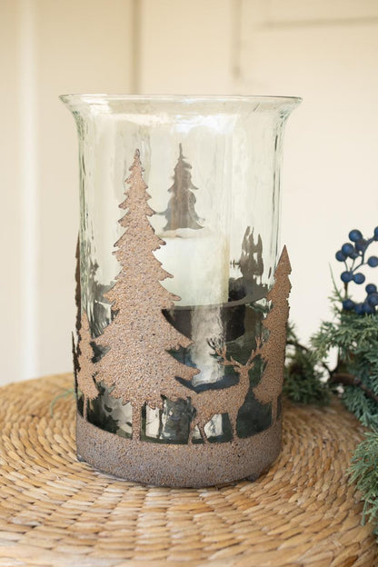 Metal Christmas Trees and Deer Cylinder Wrap, A cylindrical iron sleeve with cutout Christmas trees and deer, standing on three ball feet.