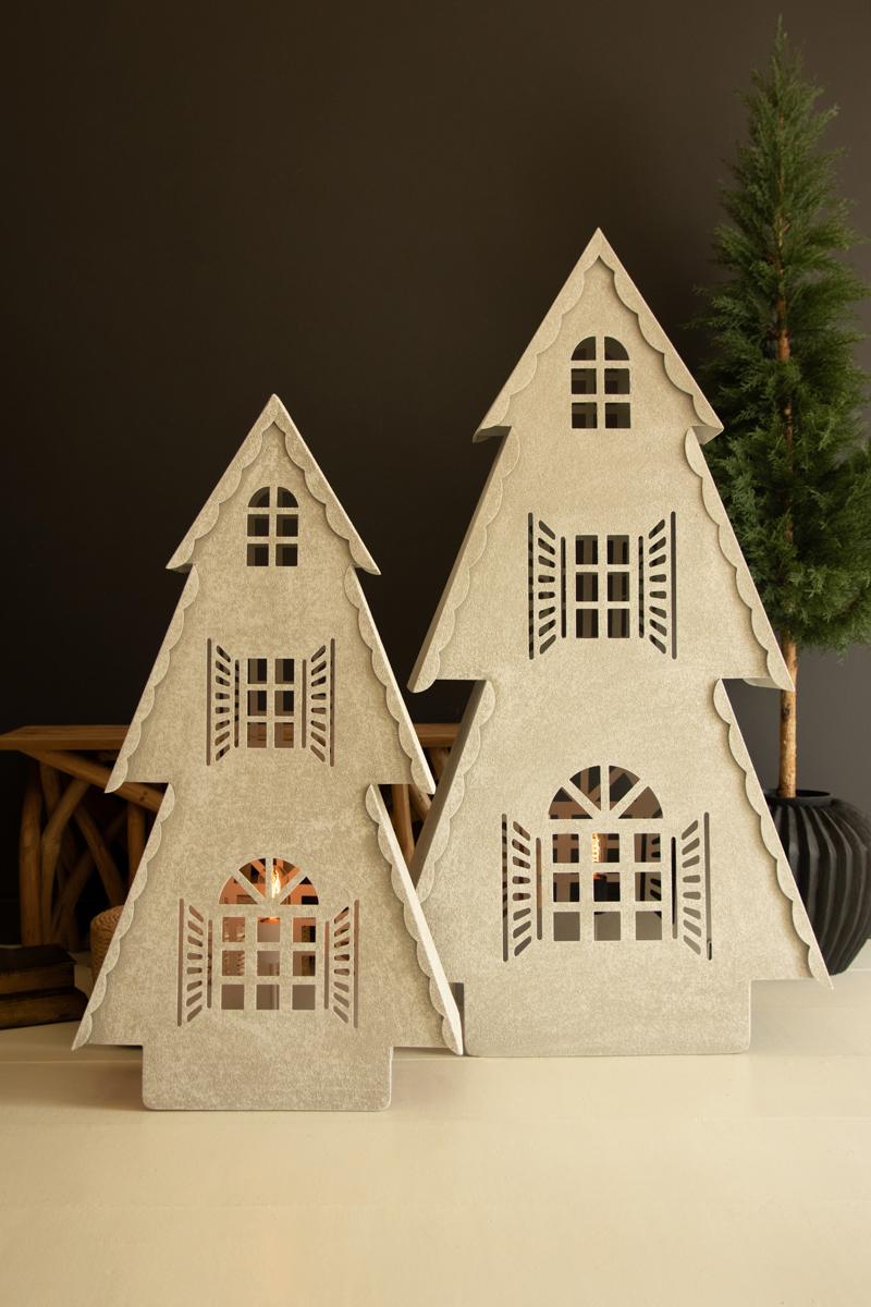 Metal Christmas Village Lamp, Two illuminated metal Christmas village house lamps, one large and one small, glowing from inside.