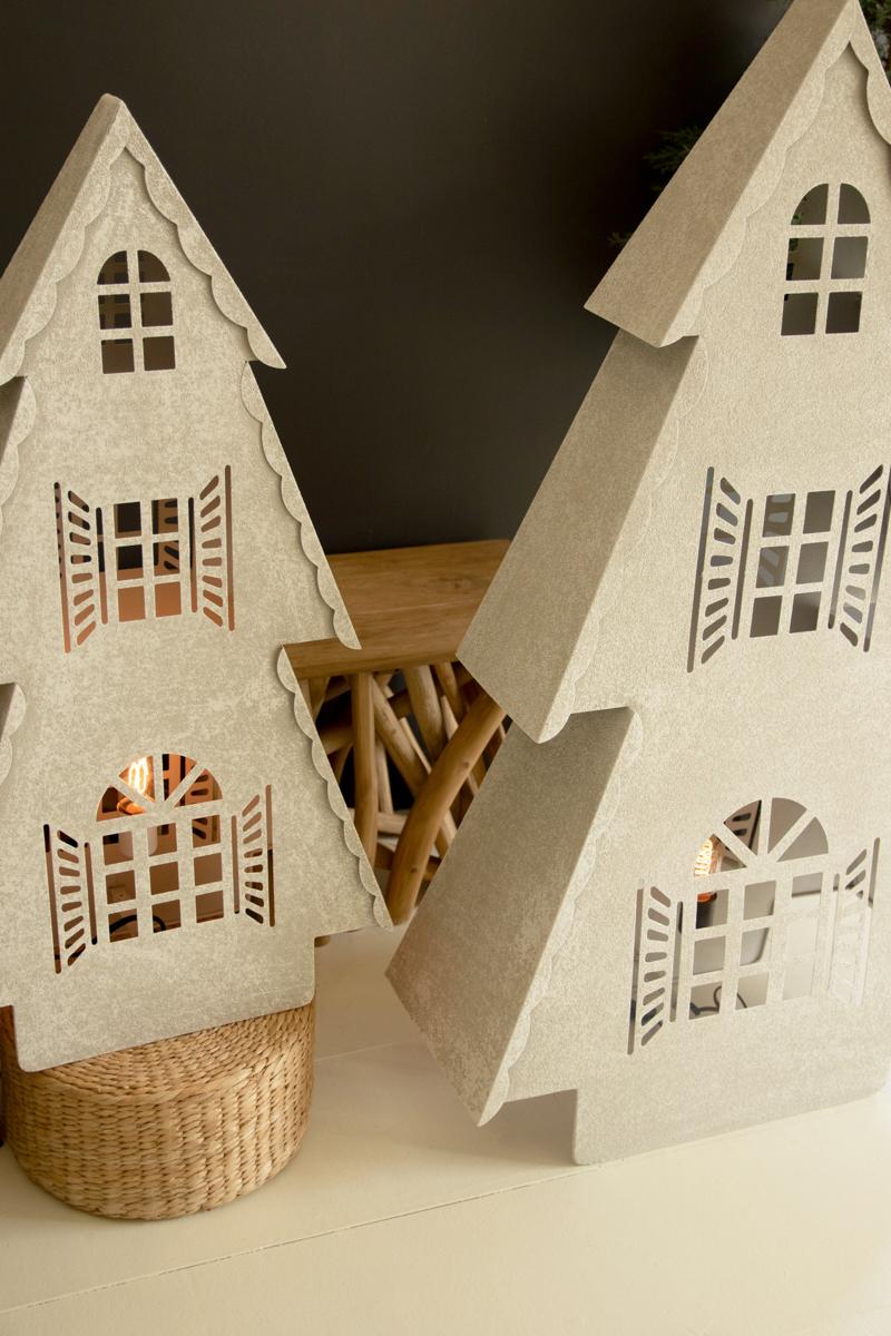Metal Christmas Village Lamp, Two illuminated metal Christmas village house lamps, one large and one small, glowing from inside.