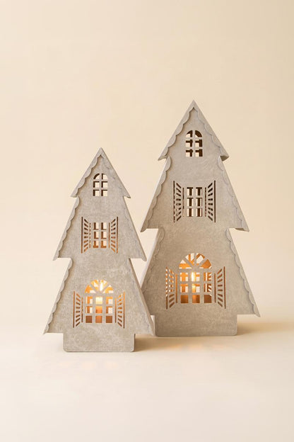 Metal Christmas Village Lamp, Two illuminated metal Christmas village house lamps, one large and one small, glowing from inside.