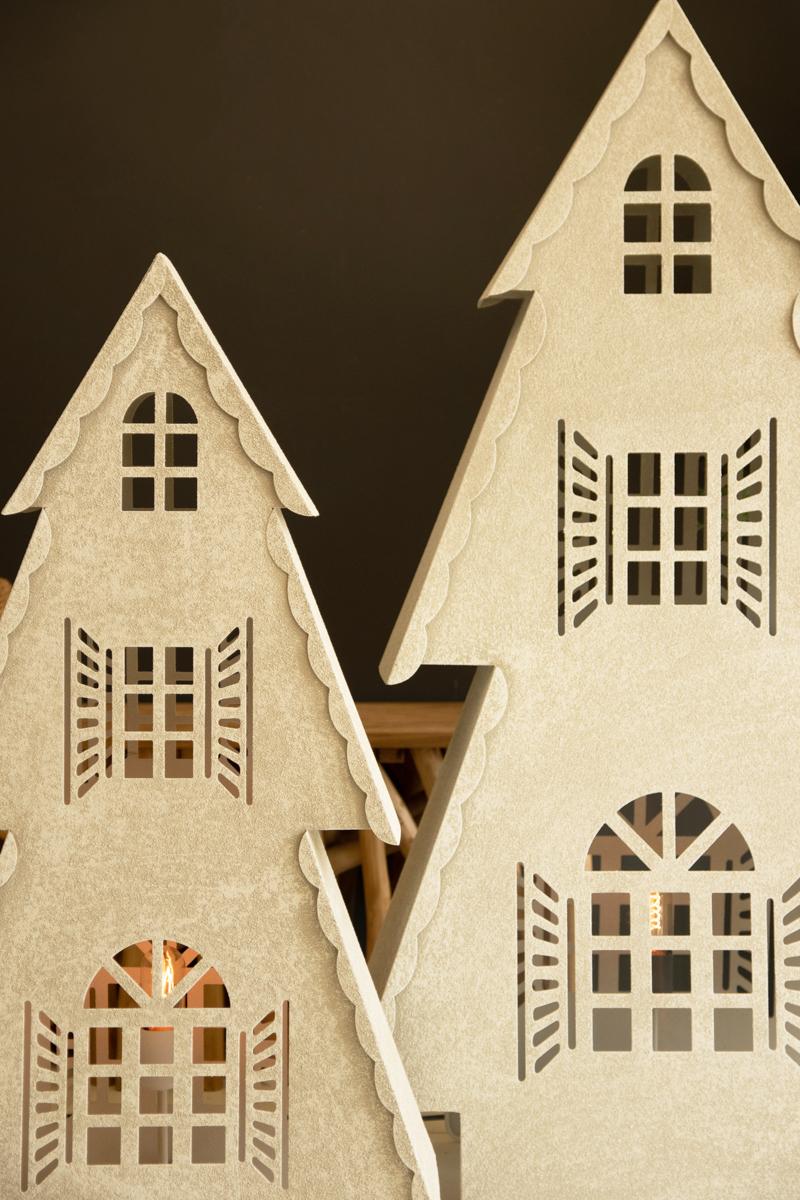 Metal Christmas Village Lamp, Two illuminated metal Christmas village house lamps, one large and one small, glowing from inside.