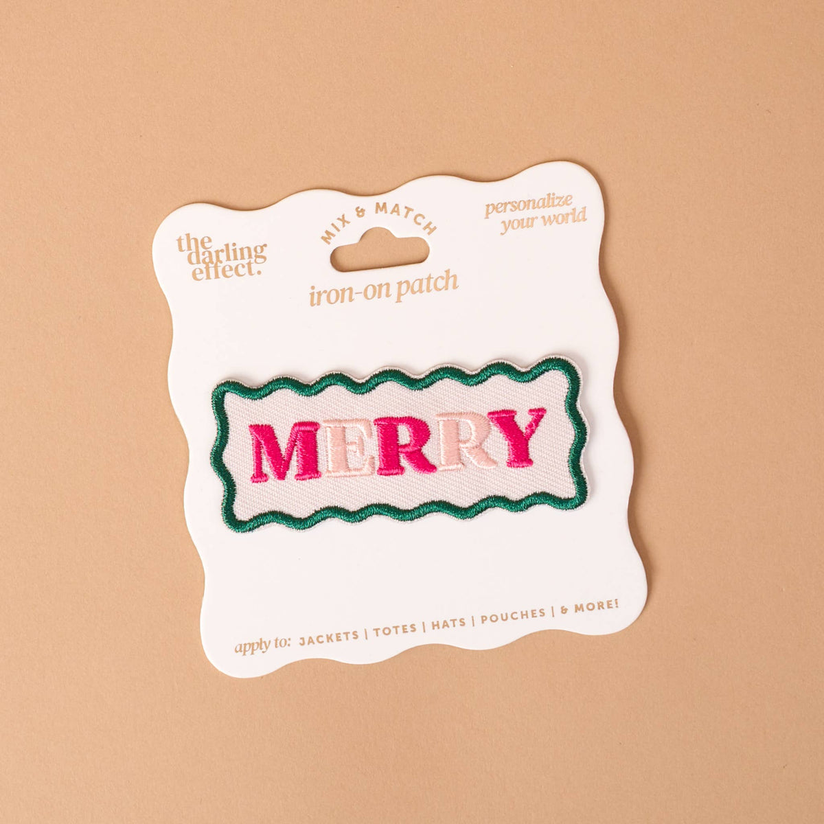 Mix & Match Iron-On Patch, A pink Be Kind patch on its patch card, with BE KIND spelled out in bold pink lettering.