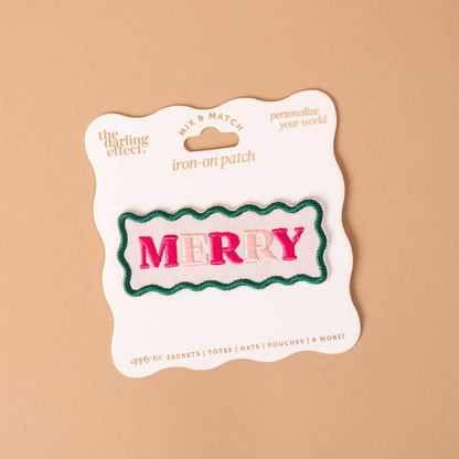 Mix & Match Iron-On Patch, A pink Be Kind patch on its patch card, with BE KIND spelled out in bold pink lettering.