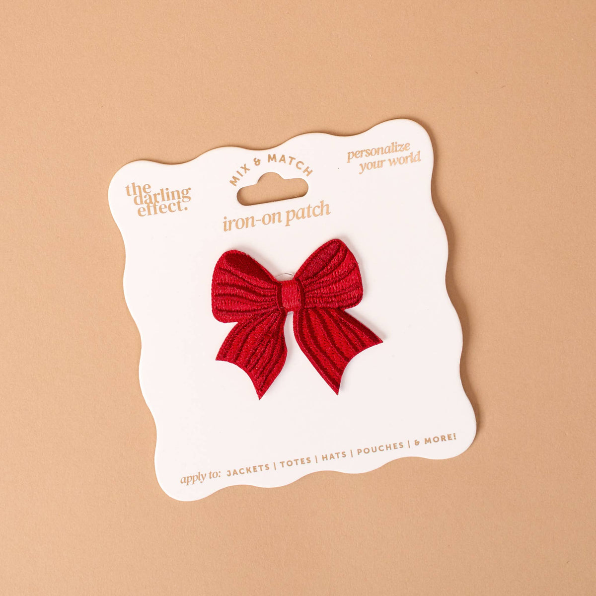 Mix & Match Iron-On Patch, A pink Be Kind patch on its patch card, with BE KIND spelled out in bold pink lettering.