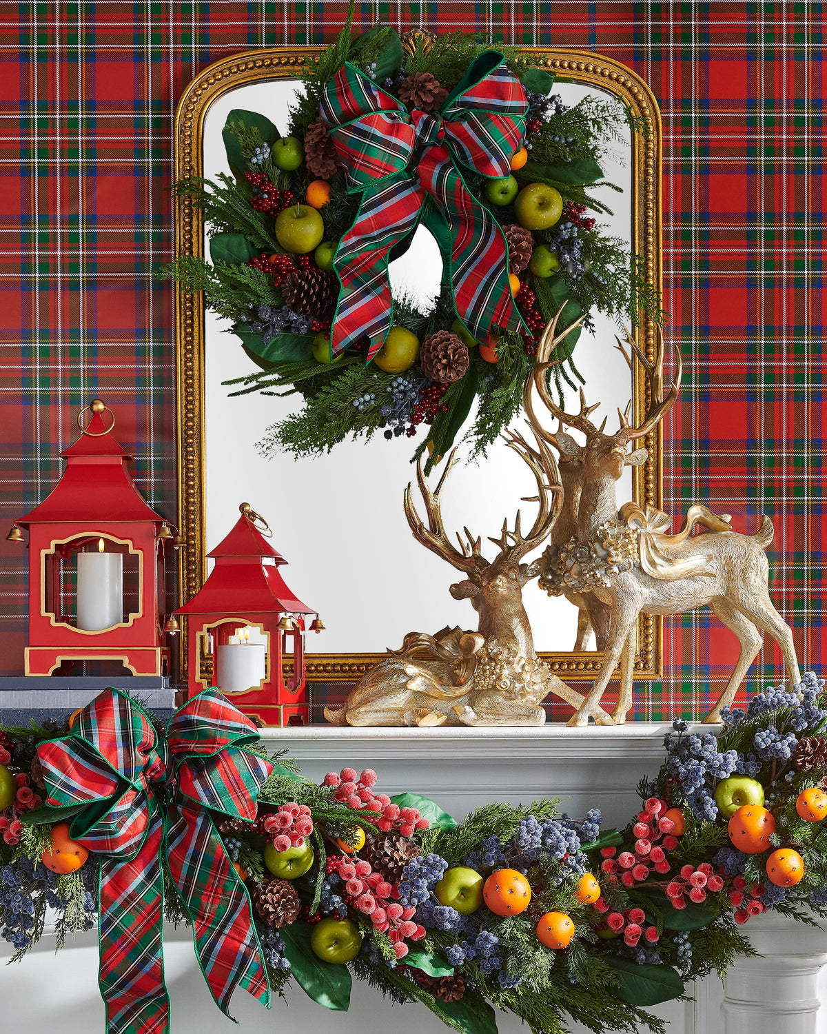 Mixed Fruit Wreath, The photo shows a round wreath of mixed greenery, pinecones, red berries, and faux green apples and oranges.